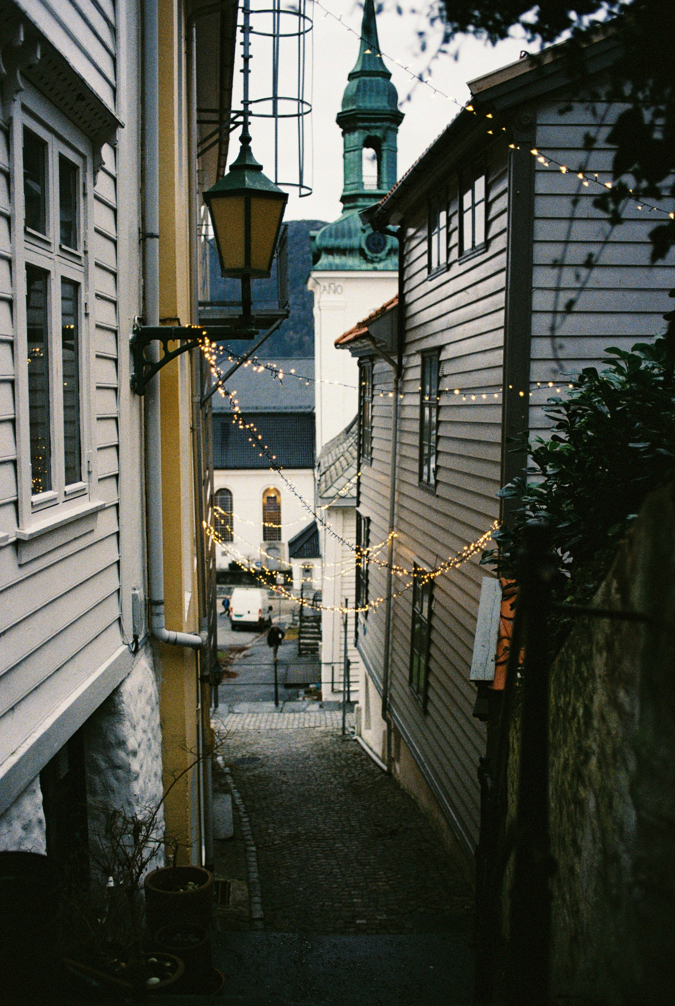 Narrow alleyway between wooden houses