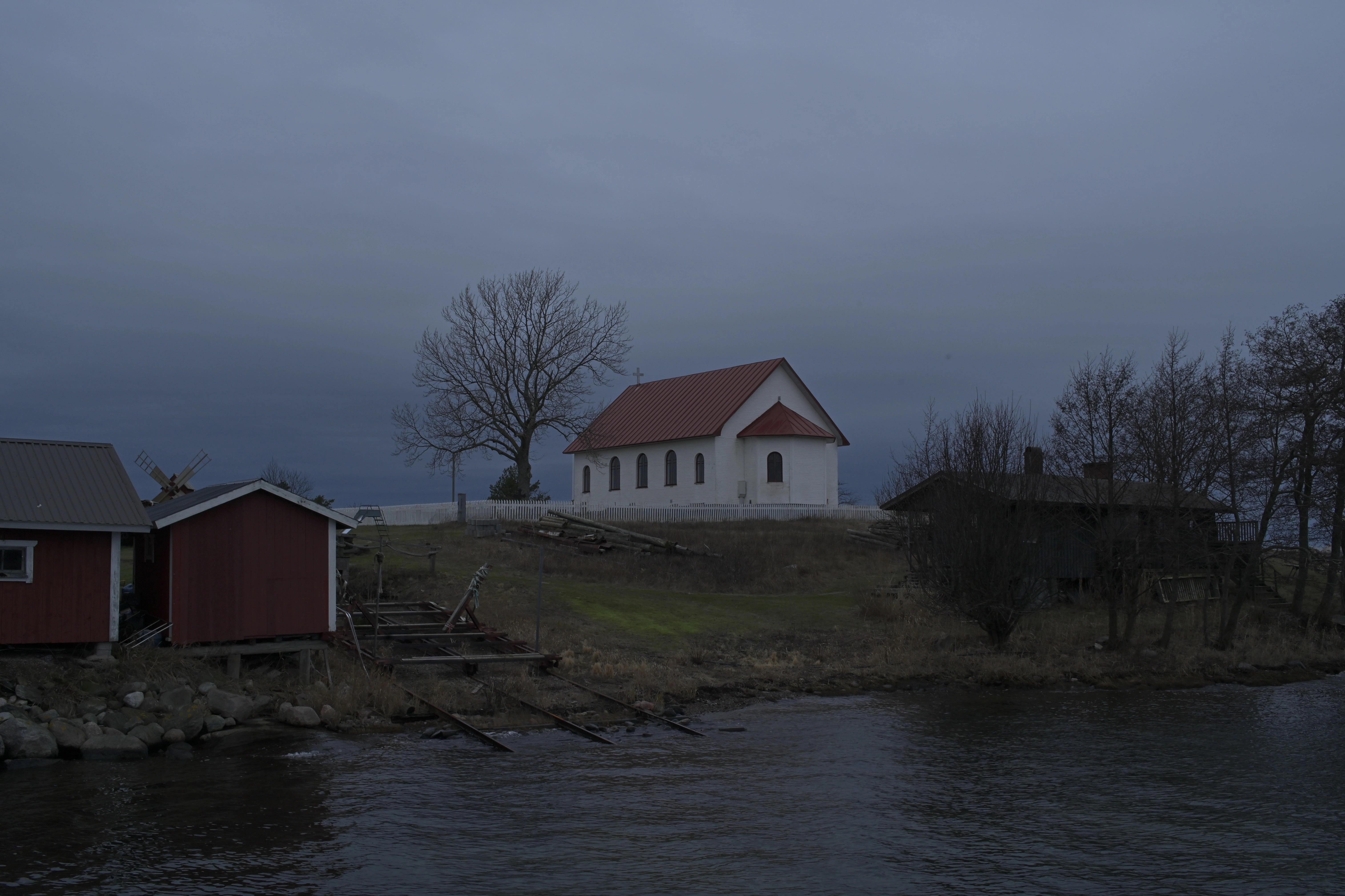 View of a church on a hill from the water